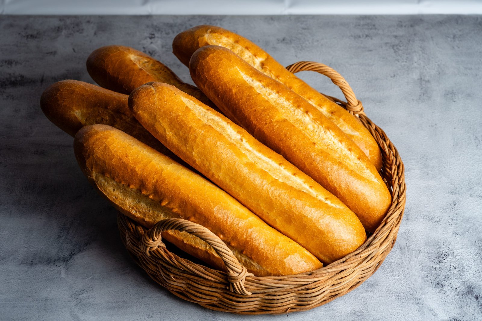 Basket of freshly baked Vietnamese baguettes, essential for making b&aacute;nh m&igrave; sandwiches at Carrot & Daikon restaurant in Henderson, NV.
